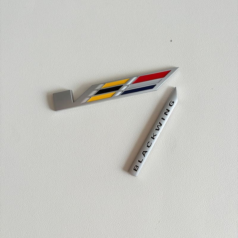 Cadillac Blackwing Metal Emblem 2 Rear of the emblem showing the adhesive backing