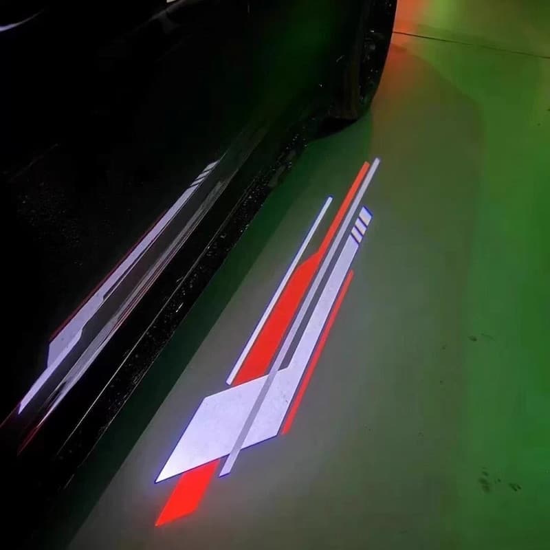 Cadillac Side Mirror Puddle Lights 2 Crest projection on dark tarmac at night
