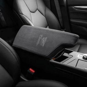 Suede Cadillac armrest cover fitted to the centre console lid